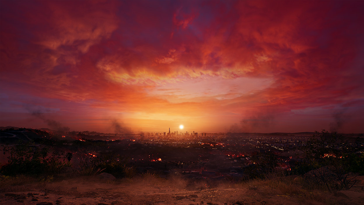 The sun sets on LA, illuminating the sky and clouds with a reddish orange glow.