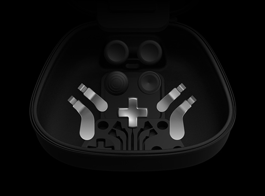 Contents of the Complete Component Pack: thumbsticks, d-pad, paddles, charge stand, USB-C cable and carry case.
