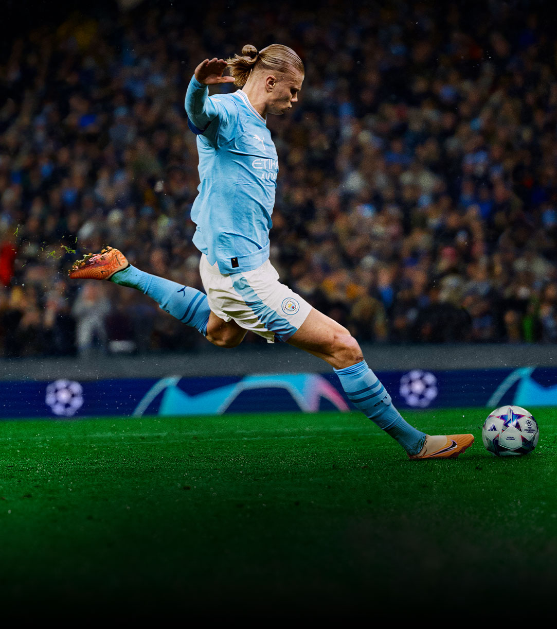 Screenshot from EA SPORTS FC™ 24 of a player in a blue shirt kicking a ball.
