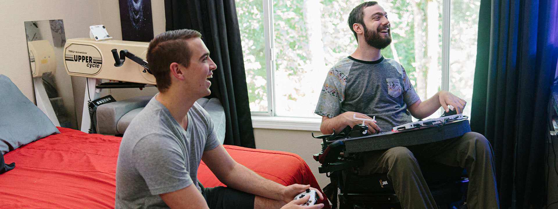 Spencer plays a game using his custom adaptive controller set-up.