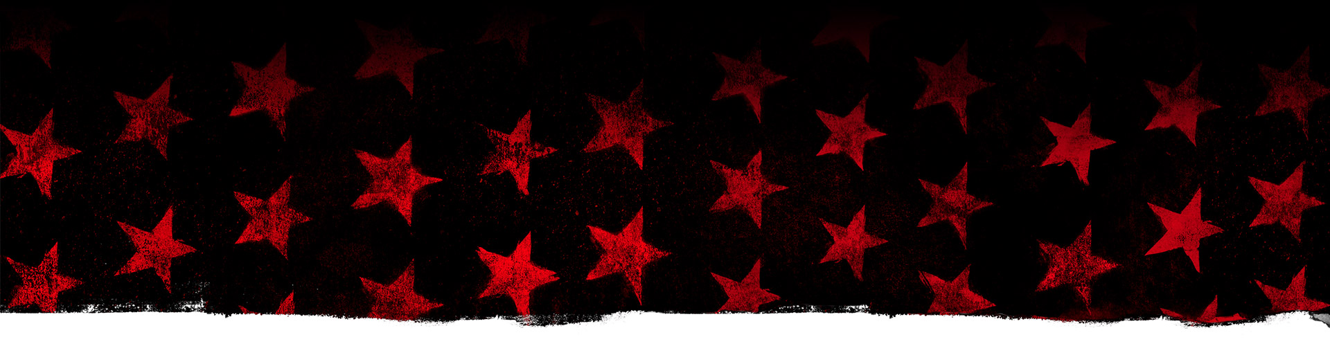Rode sterren tegen een zwarte achtergrond.
