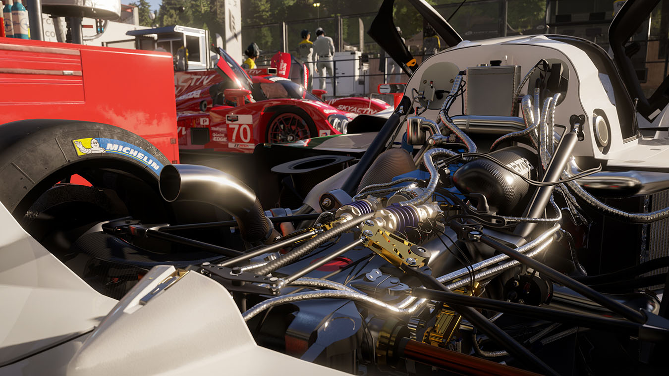 update main gallery with image: A clean engine bay from a race car in the pit.
