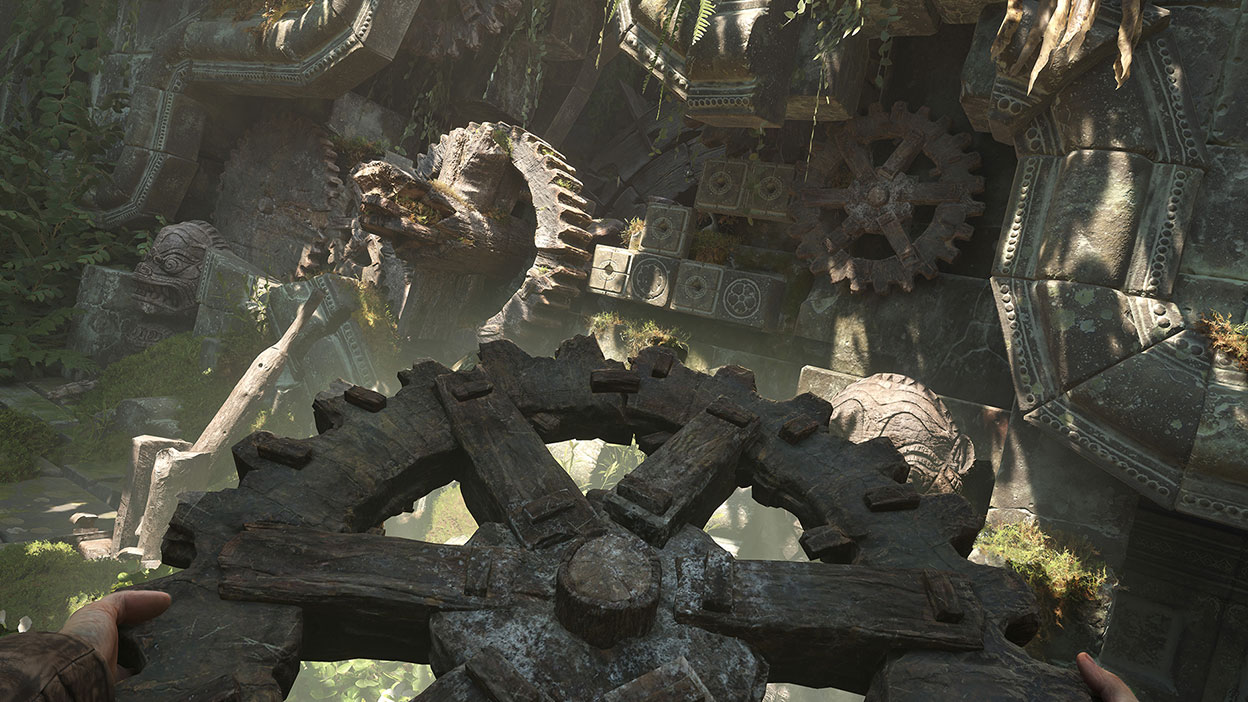 From a first-person perspective, Indiana Jones works to place a wooden gear into a stone mechanism.