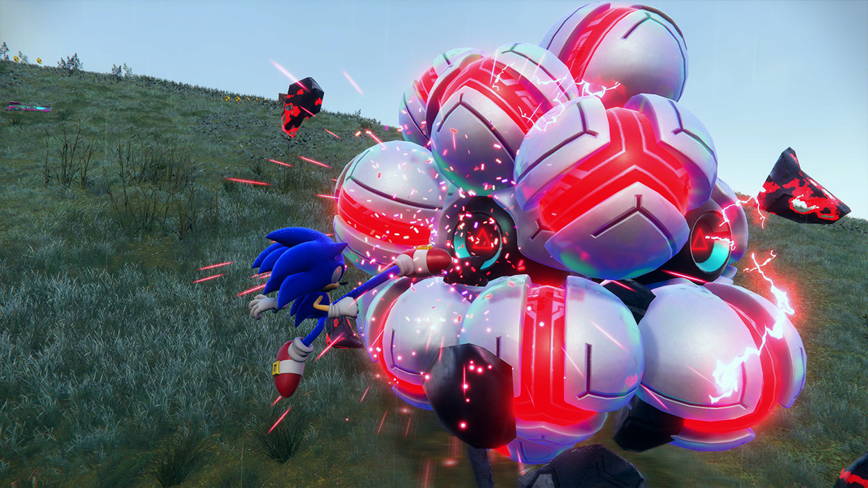 Sonic útočí na kovového nepriateľa pokrytého žiariacimi červenými guľami.