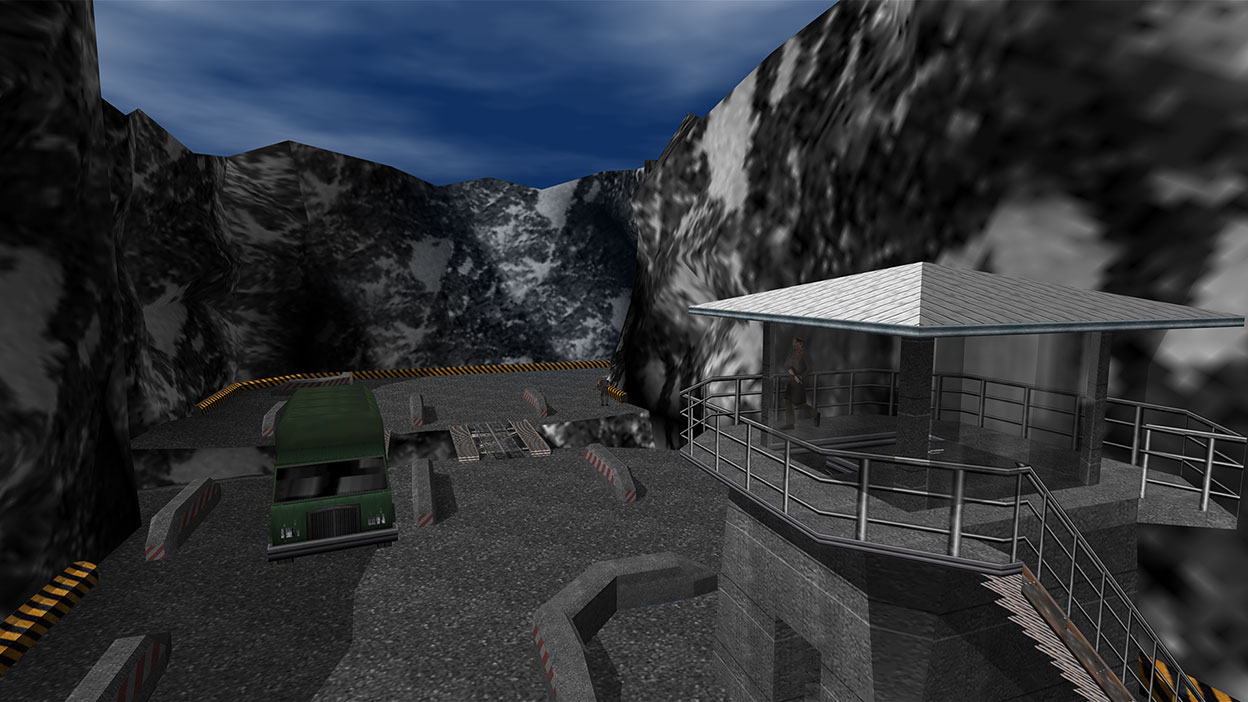 A van enters a militarised encampment hidden in the mountains