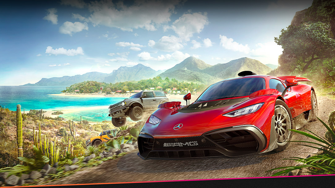 Cars from Forza Horizon 5 moving fast through a dirt track by water and many plants.