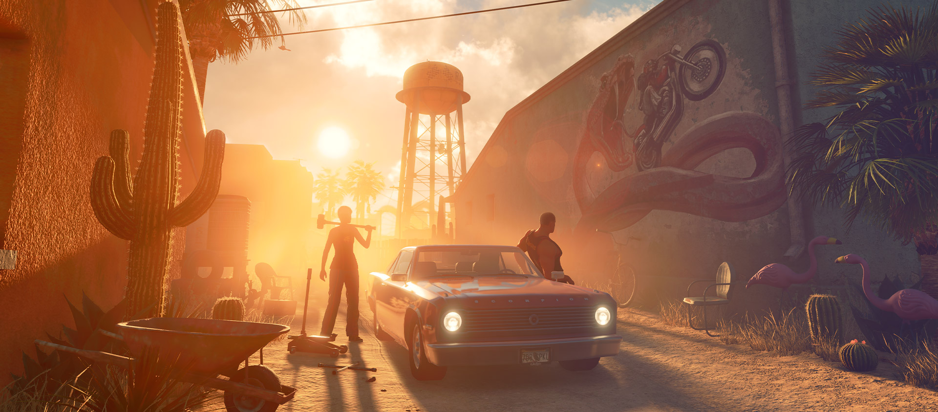 The setting sun casts long shadows over two people repairing a muscle car.