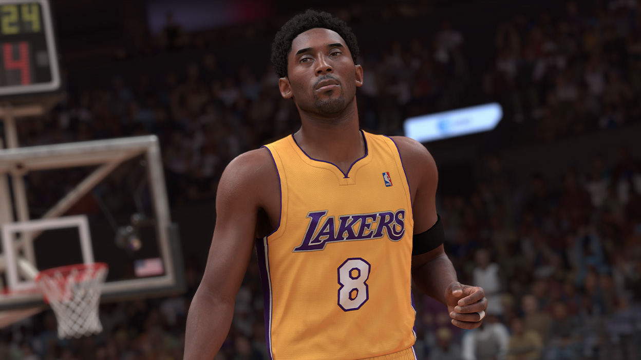 Kobe Bryant wears a number 8 Lakers jersey and looks across the court with a focused stare.