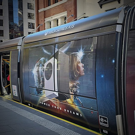 A light rail train in Sydney Australia that has an Xbox Series X|S and Starfield wrap.