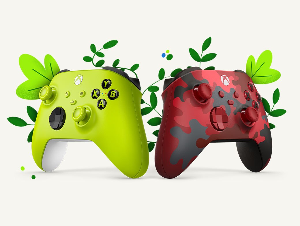 The Electric Volt and Daystrike Camo Wireless Controllers are angled to the left and right in front of green plants.
