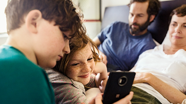 A family accessing Xbox with a Family Account