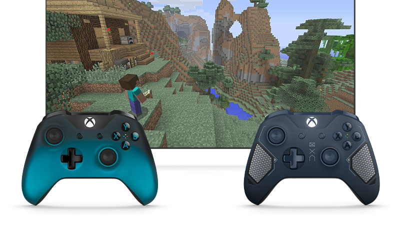 两个 Xbox 控制器直立在屏幕前方，屏幕上显示《Minecraft》中的场景