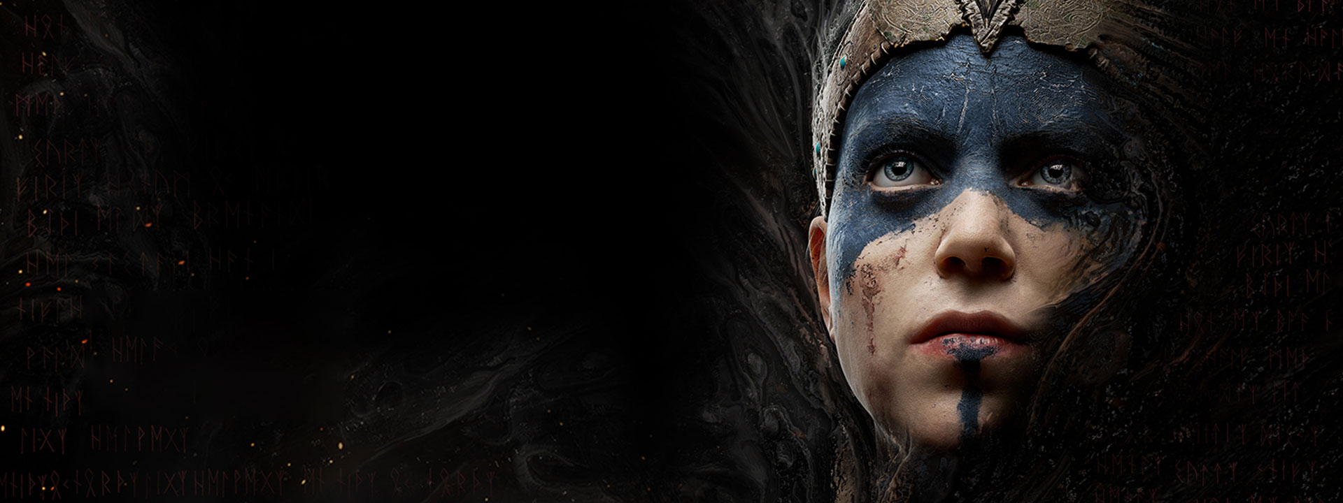 Senua wears blue face paint with a leather crown.