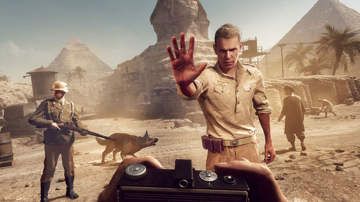 From a first-person perspective, a guard moves forward to stop the player from taking photos of the Sphinx.