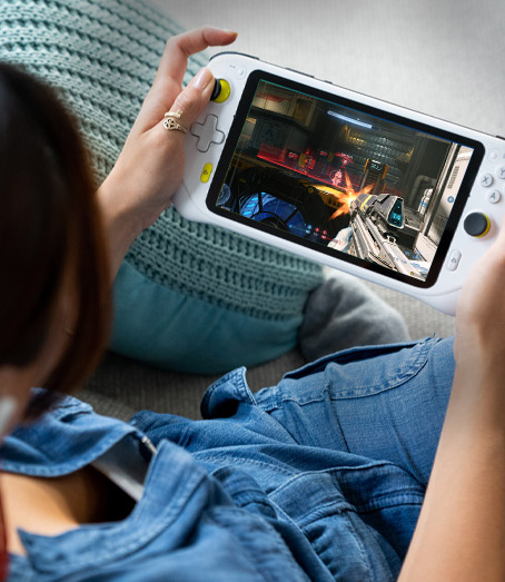 Looking down at a person playing the Logitech G Cloud Gaming Handheld showing the full front view