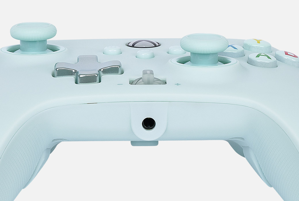 Close-up of the stereo jack on the bottom of the Cotton Candy Blue controller