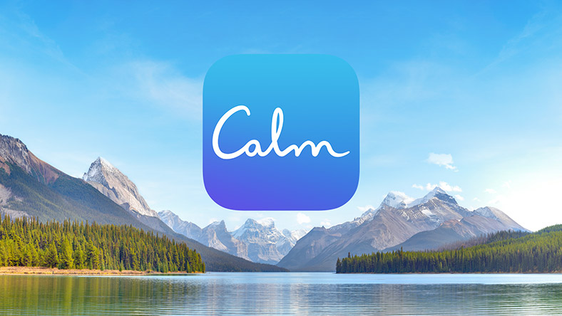 The Calm logo on top of scenery of a tranquil lake surrounded by mountains.