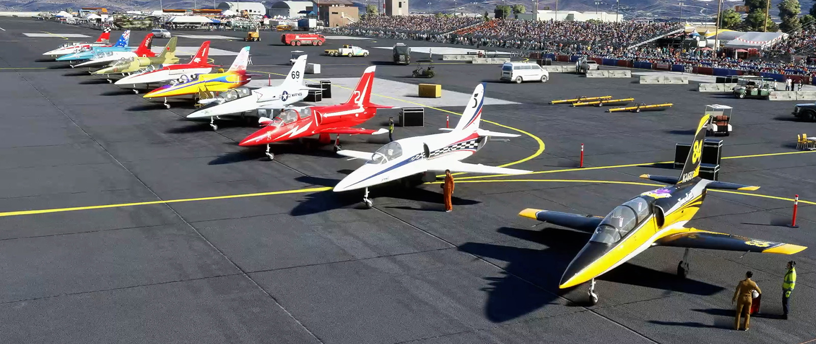 Line-up of 10 aircraft in front of a large crowd