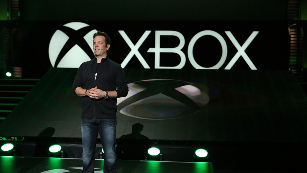 An image of the head of Xbox, Phil Spencer, giving a talk on an Xbox stage