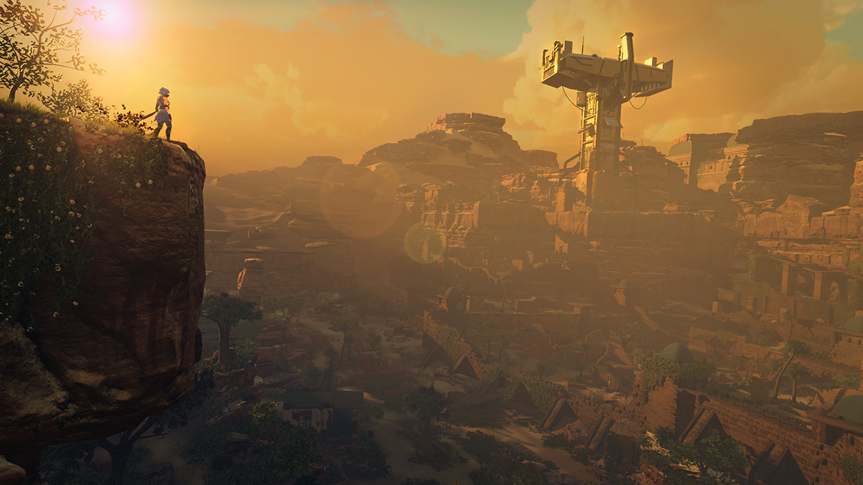 At sunset, a character stands on a cliff face looking over a beautiful rocky terrain.