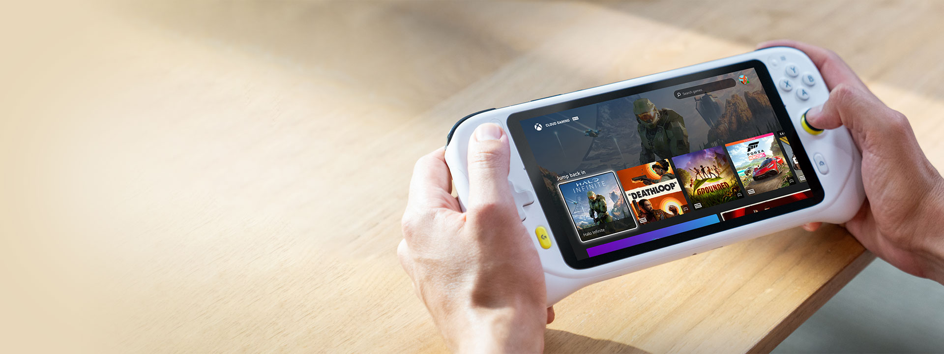 Close up of the Logitech G Cloud Gaming Handheld, showing the device UI and multiple games available via Xbox Cloud Gaming (Beta).