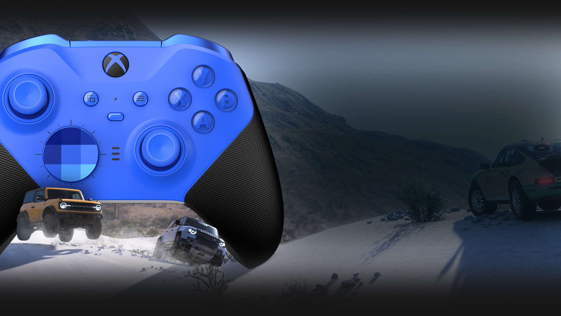 Xbox Elite ワイヤレス コントローラー シリーズ 2 – Core (ブルー) の下で、雪の中を疾走するフォード ブロンコとランド ローバー ディフェンダー。