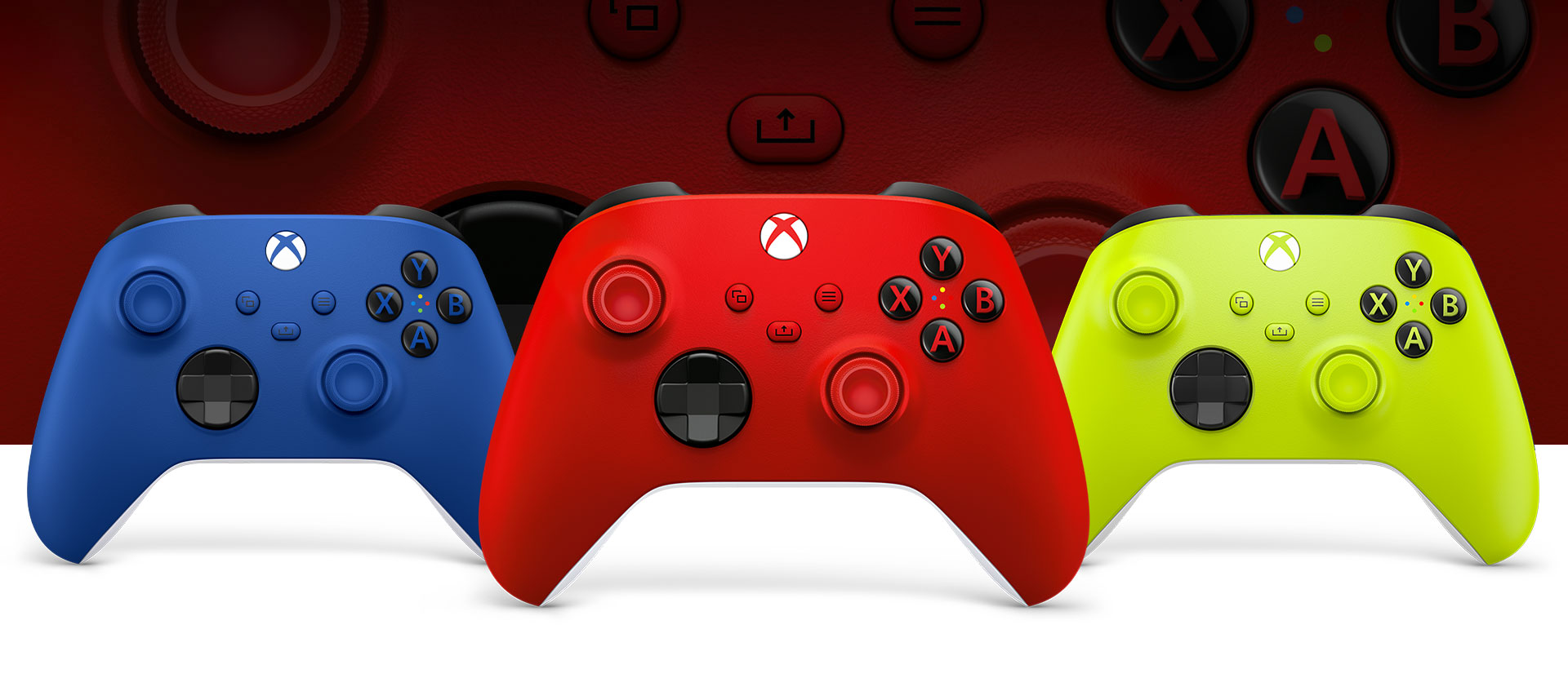 Xbox Pulse Red controller in front with the Shock Blue on left and Electric Volt on right