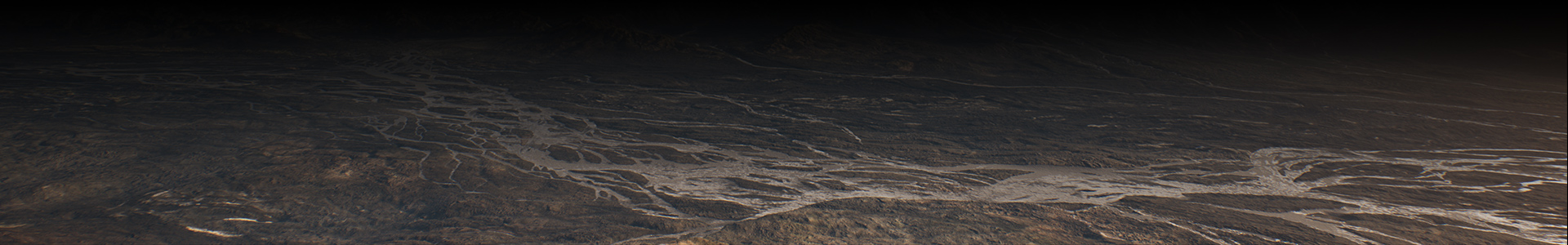 Top down view of a valley at the base of a mountain