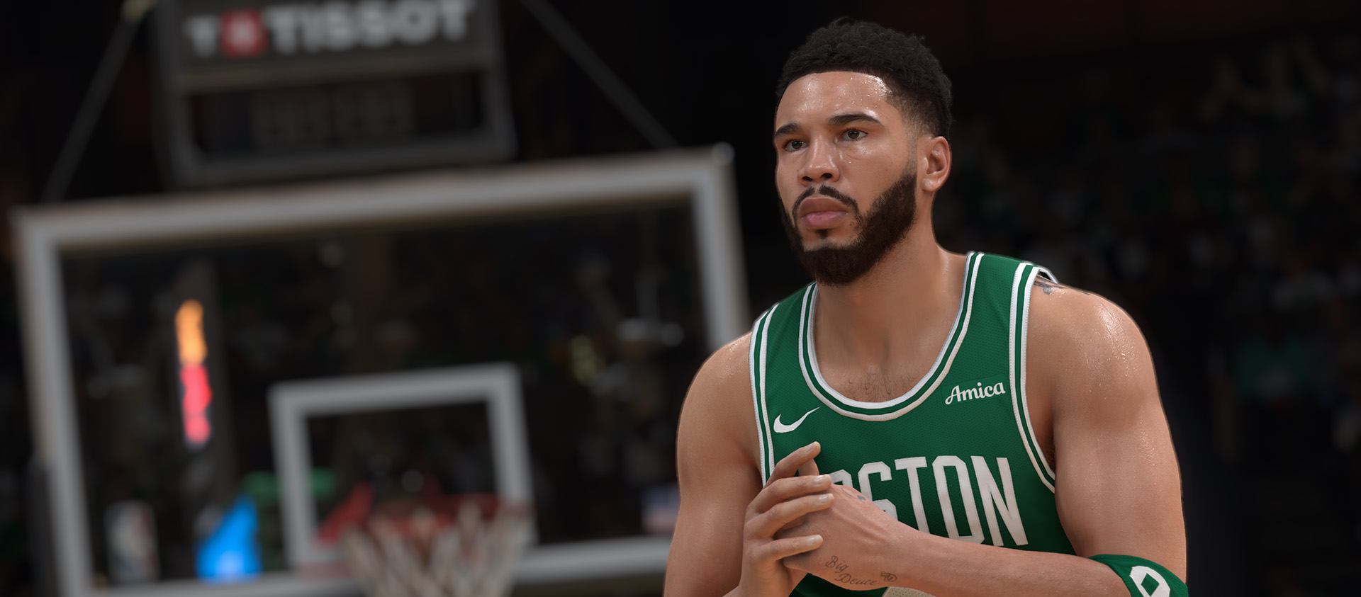 Jayson Tatum standing on the court in a number 0 Boston Celtics shirt.