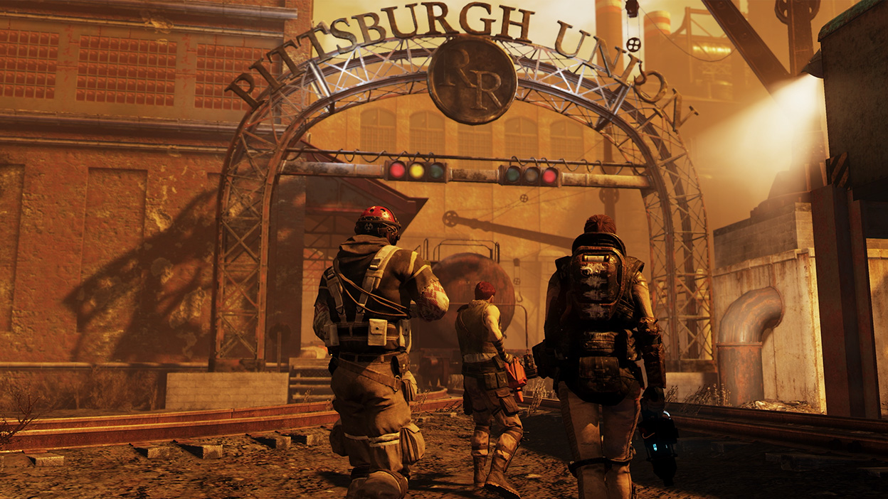 Tres personajes exploran los terrenos en ruinas de la fábrica de Pittsburgh Union.