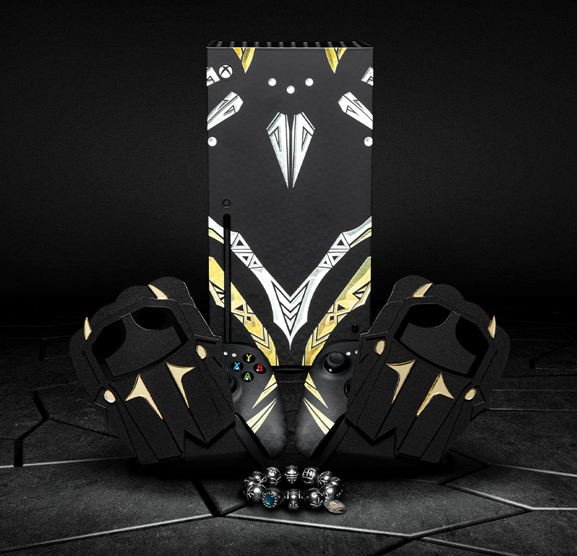 A custom Wakanda Forever-inspired Xbox Series X, complete with matching controllers that have fist design holders arranged to look like Wakanda's signature cross armed 'X' pose, plus replica Kimoyo beads