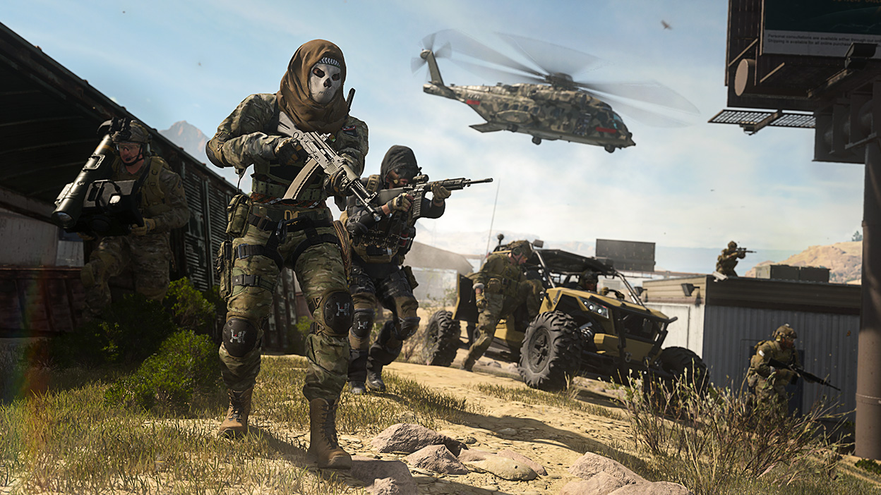 A helicopter looms overhead as a team of Operators advance on a position in Call of Duty: Modern Warfare II.