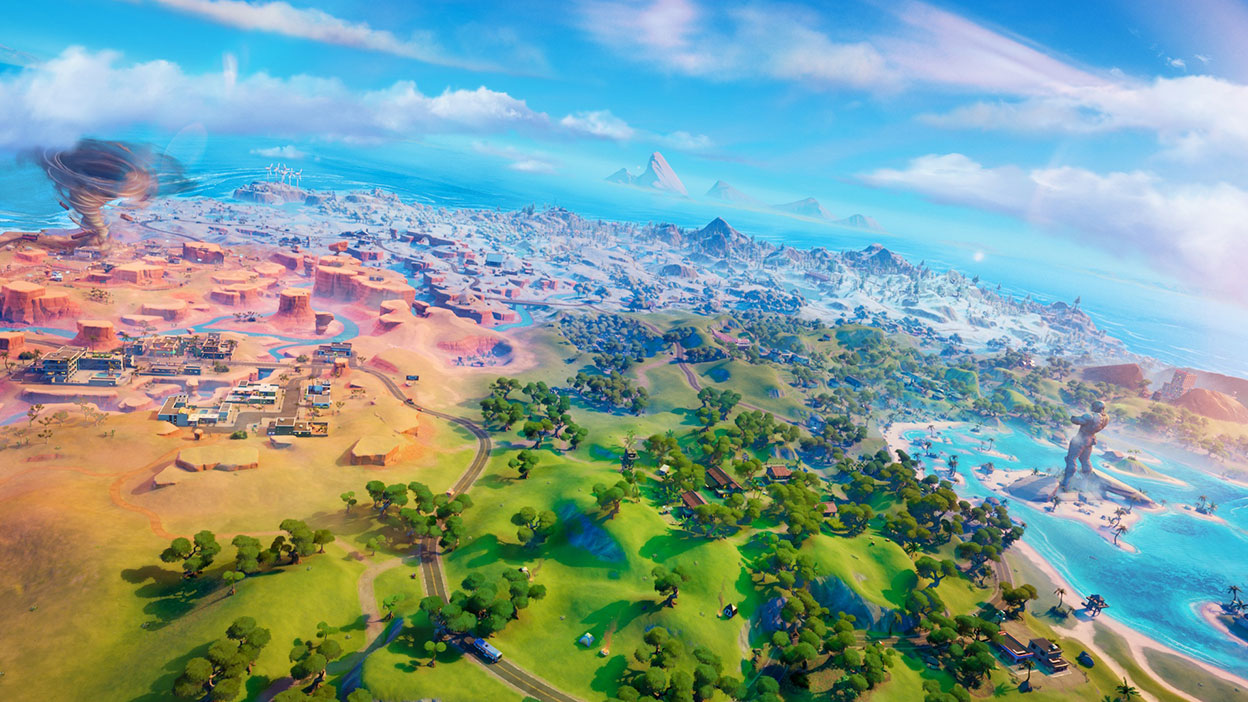 Een weids uitzicht op de wereldkaart van Fortnite, met weelderige groene velden en een tornado in de woestijn.