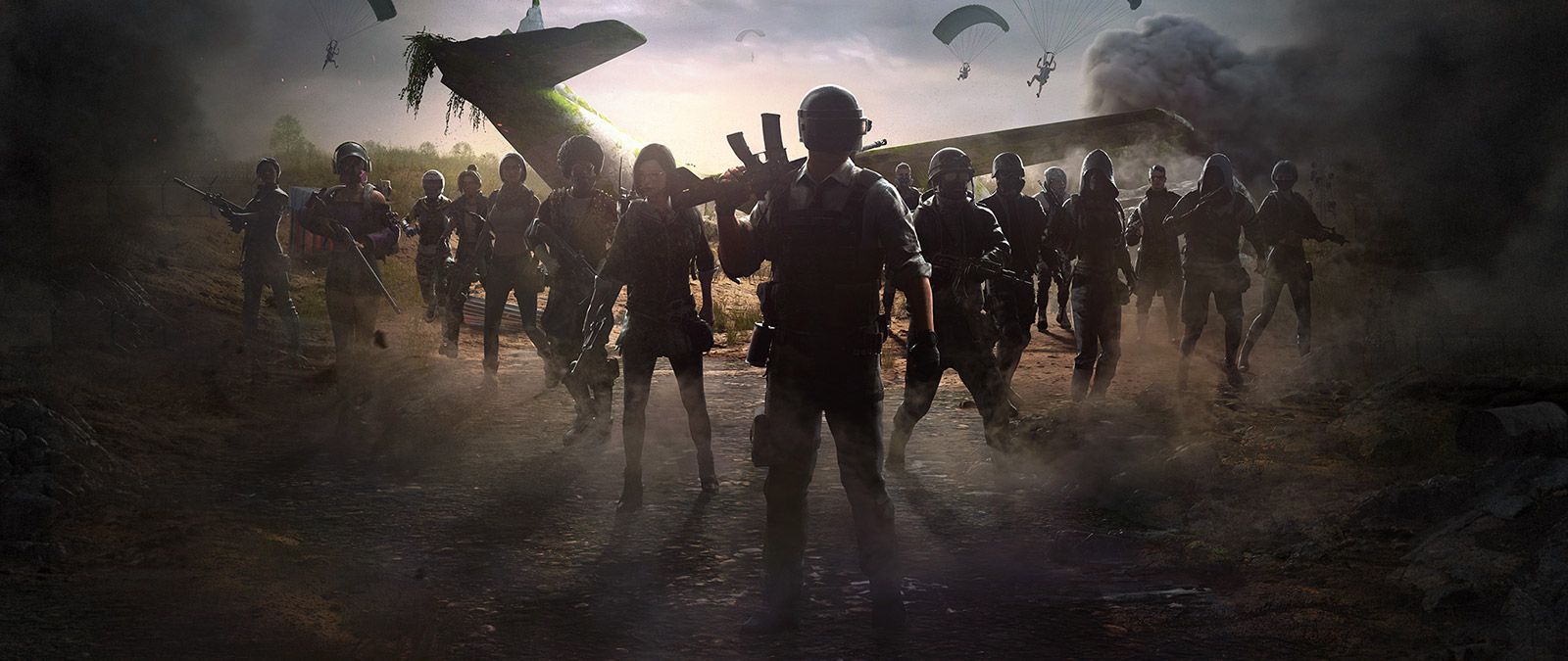 Een groep spelers verzamelt zich rond een neergestort vliegtuig, terwijl anderen met parachutes landen.