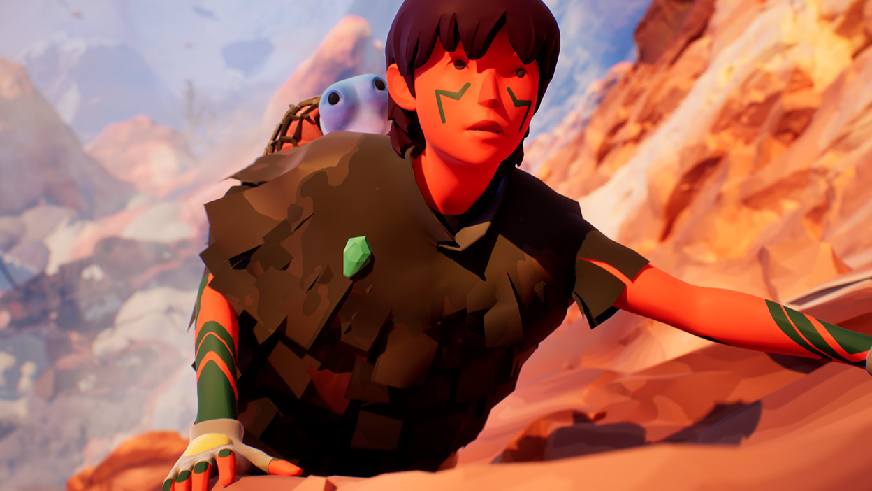 Uma foto em close-up de uma personagem olhando para cima enquanto se agarra ao lado de uma montanha.