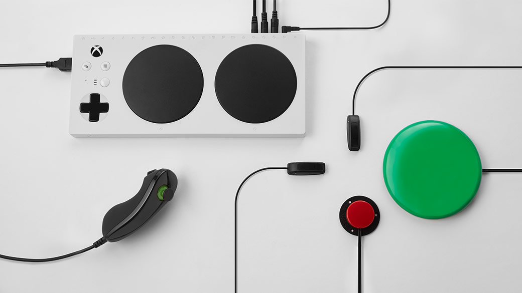 Top down view of the Xbox Adaptive Controller with added accessories connected to the controller