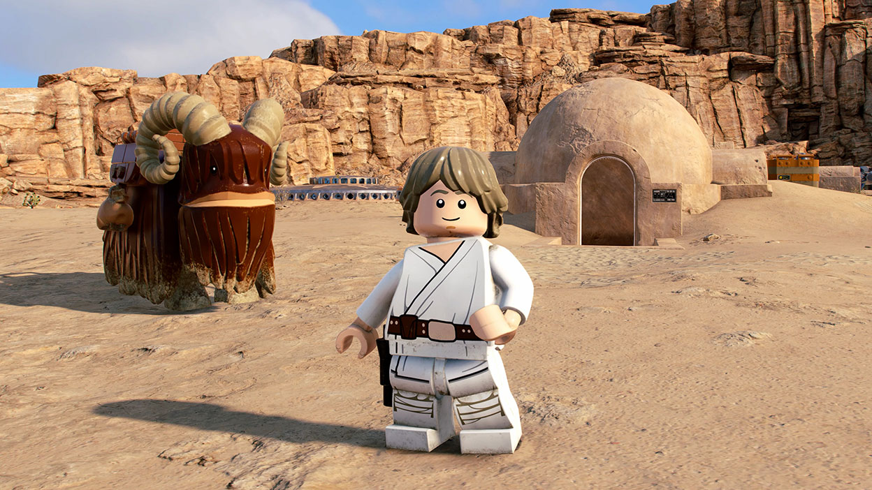 Luke Skywalker stands with a bantha in front of his uncle’s home on Tatooine.