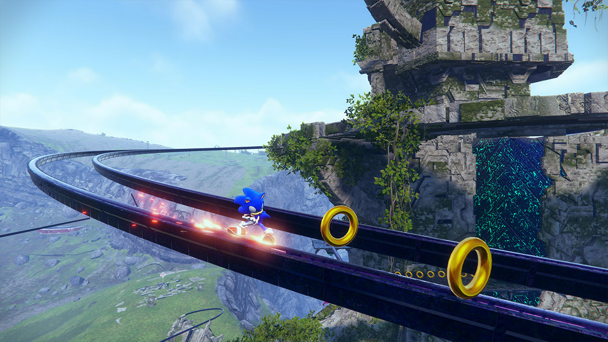 Sonic이 금반지를 모으면서 빠른 속도로 레일을 따라 달립니다.