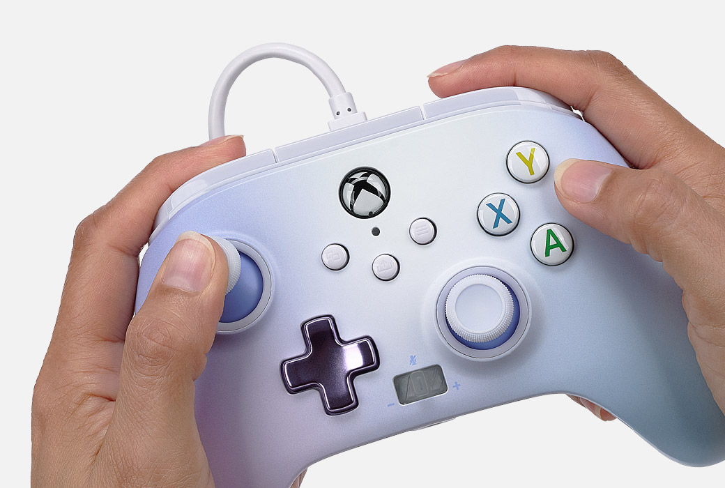 Hands holding the Pastel Dream controller