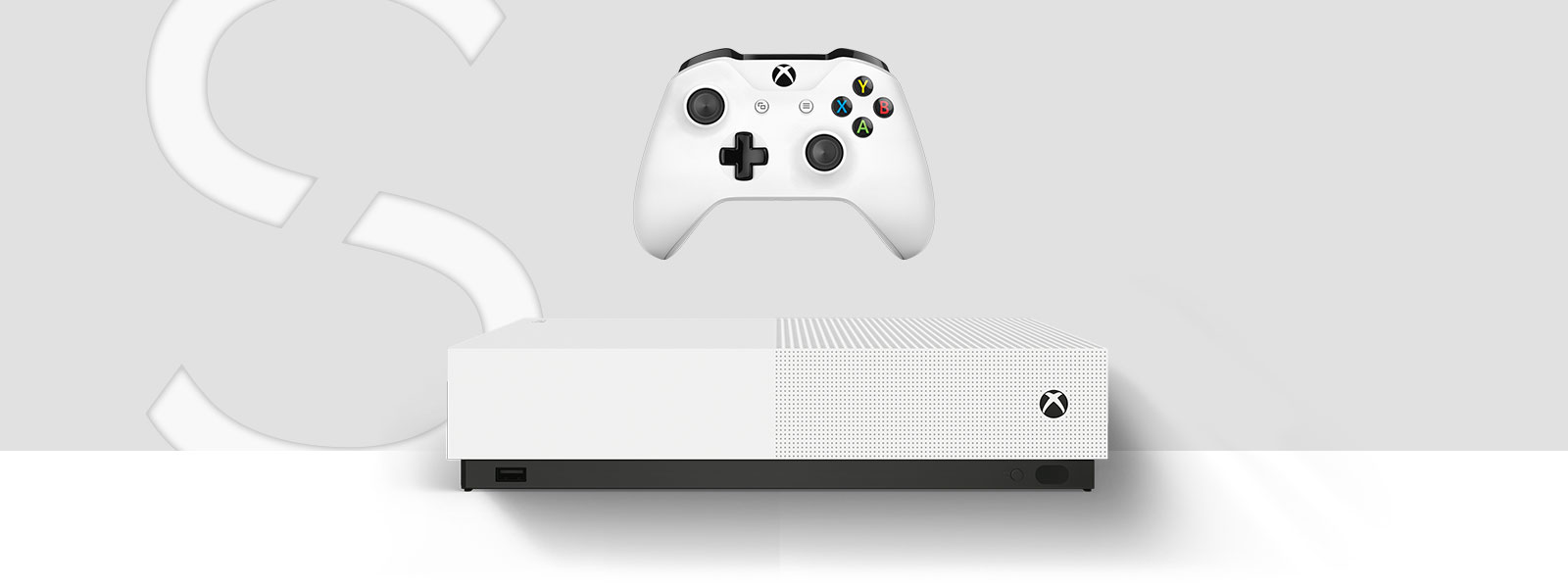 一台 Xbox One S All-Digital Edition 主机的正视图，位于一个巨大的艺术字 S 前方