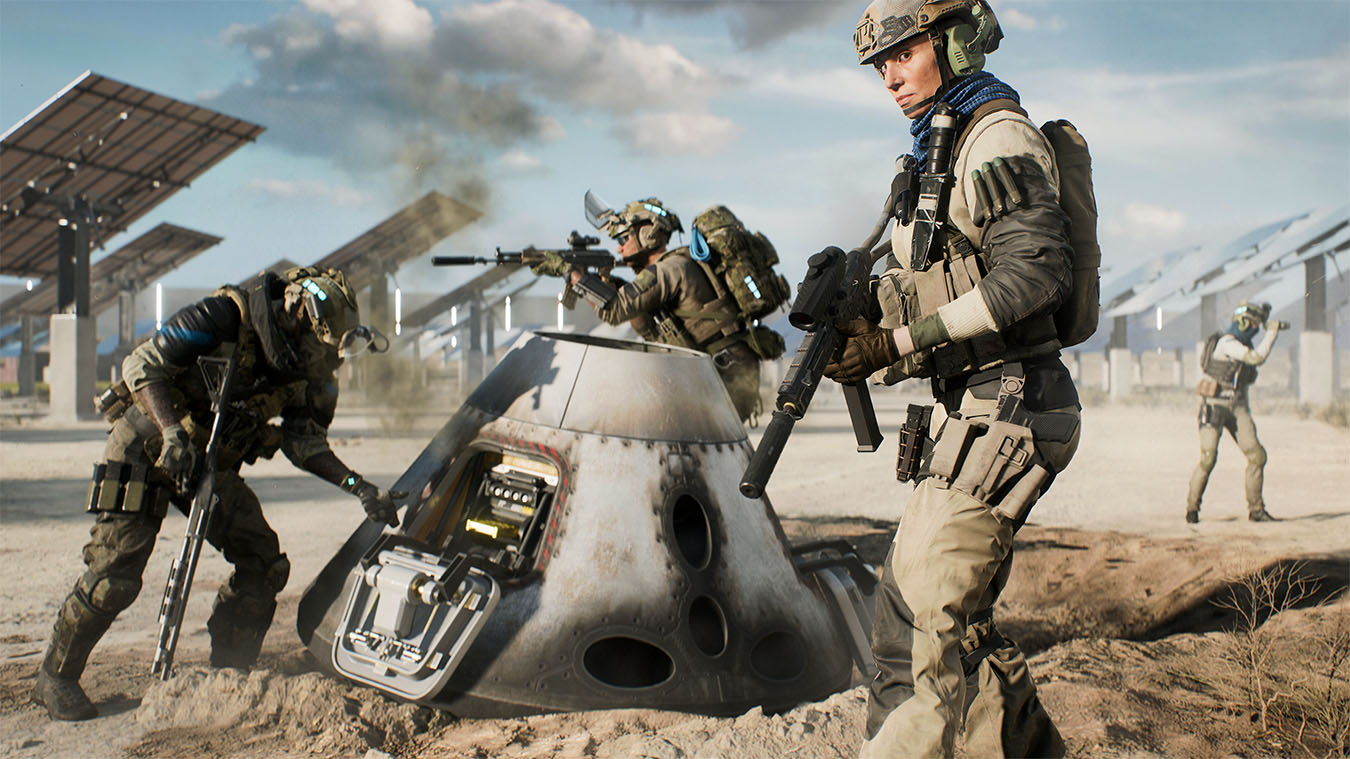 update main gallery with image: Four soldiers inspecting a equipment that had fallen from the sky