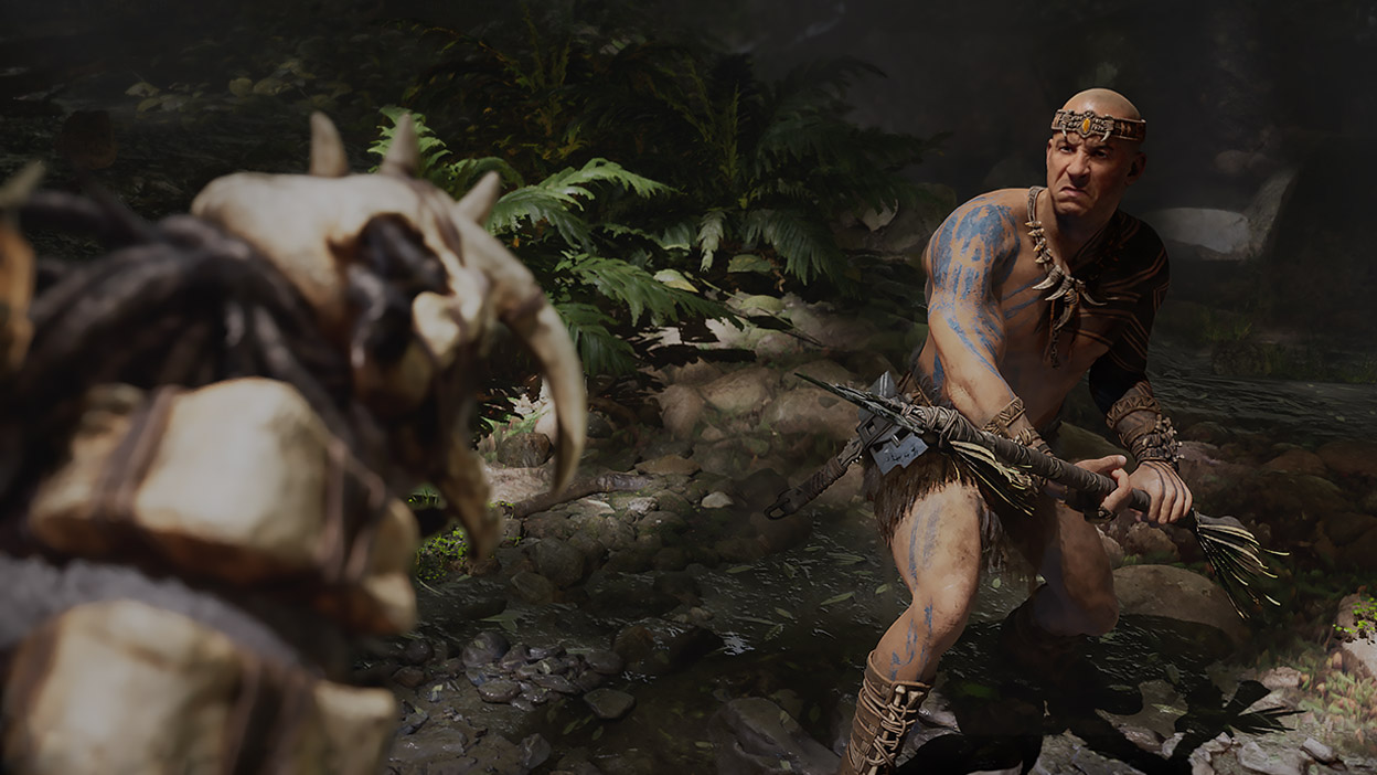 Santiago crouches with a spear in defence against a large creature. 