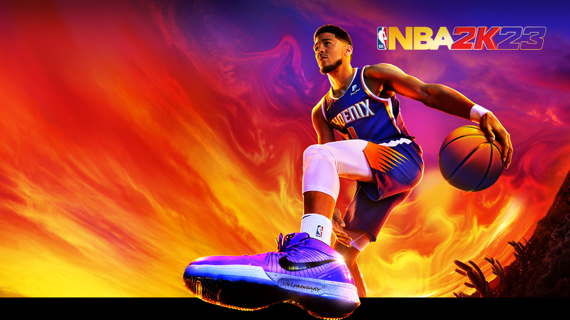 NBA 2K23, 피닉스 선즈의 1번인 데빈 부커가 다채로운 사막 하늘 아래에서 농구공을 드리블합니다.