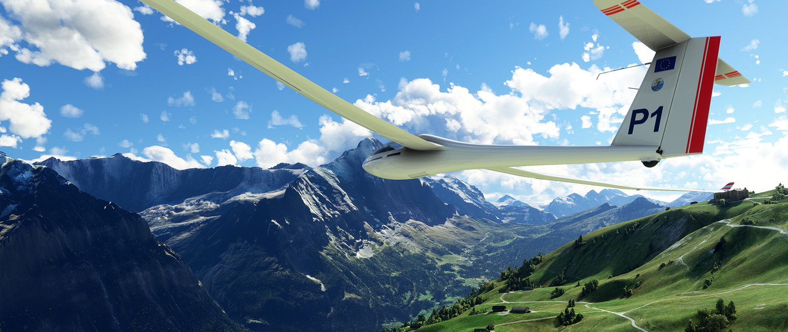 A slim aircraft glides lazily over lush green hills against a backdrop of mountains.