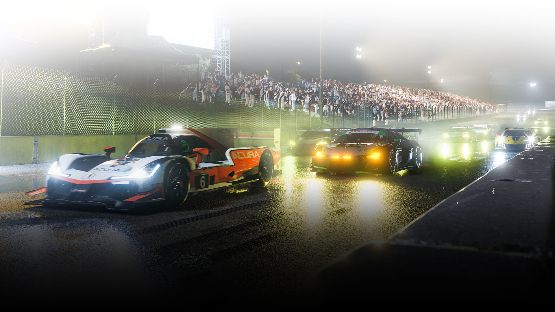 Varios autos de carreras se alinean en un circuito húmedo por la noche.