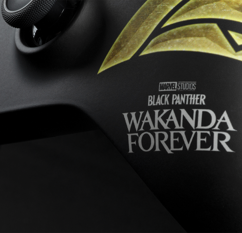Close up on a custom Wakanda Forever-inspired Xbox Wireless Controller printed with the Marvel Studios' Black Panther Wakanda Forever logo