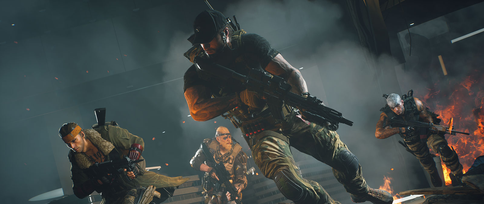 Four operators run through a burning building.