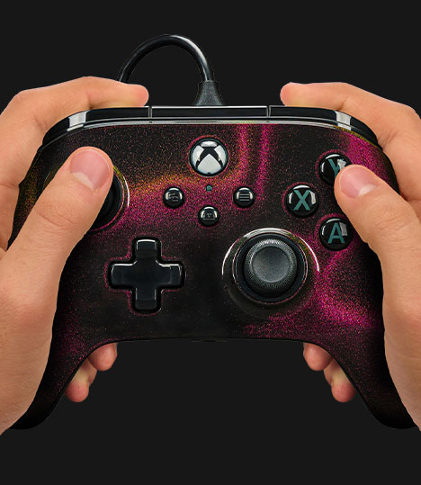 Hands holding the PowerA Advantage Wired Controller for Xbox Series X|S - Sparkle