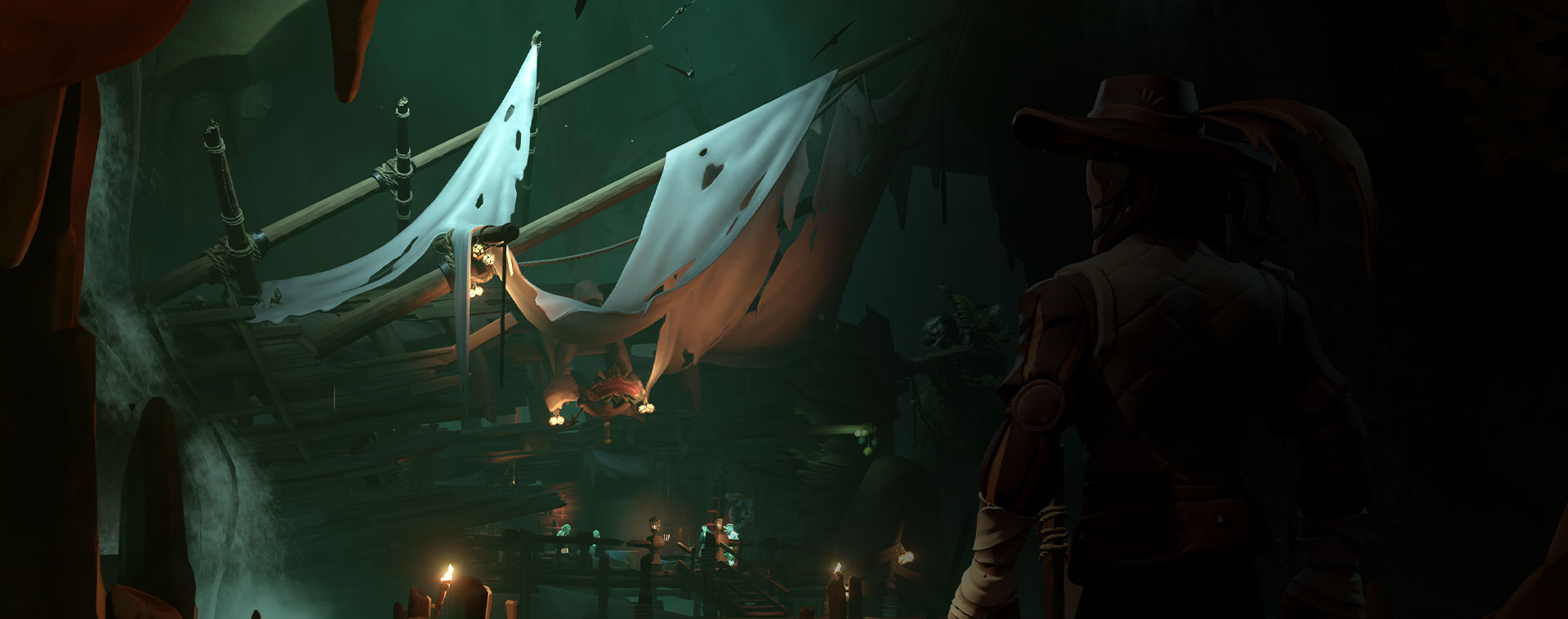 Charakter aus Sea of Thieves betrachtet ein zerstörtes Schiff