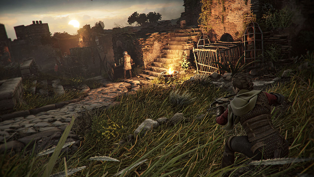 Amicia readies her crossbow while under the cover of an outcrop of tall grass.